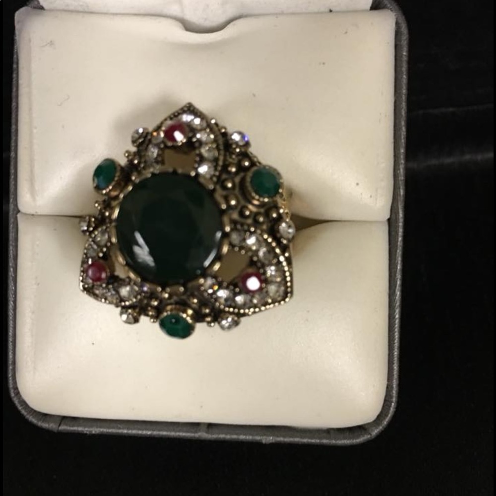 Beautiful ring with big green stone.